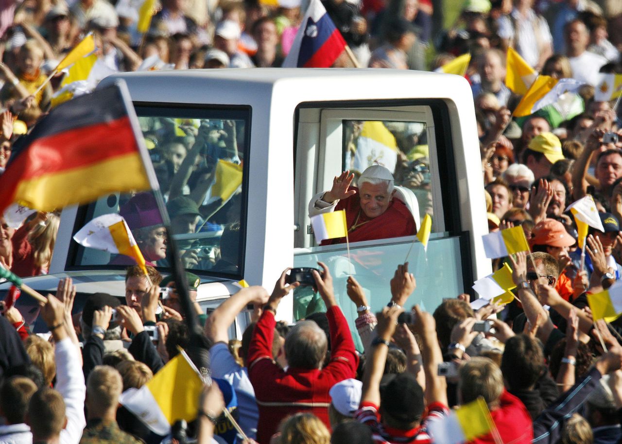 The Pope waves to people from his "popemobile" as he arrives for a Mass in Regensburg, Germany, in September 2006. He was on a six-day visit to his native country.