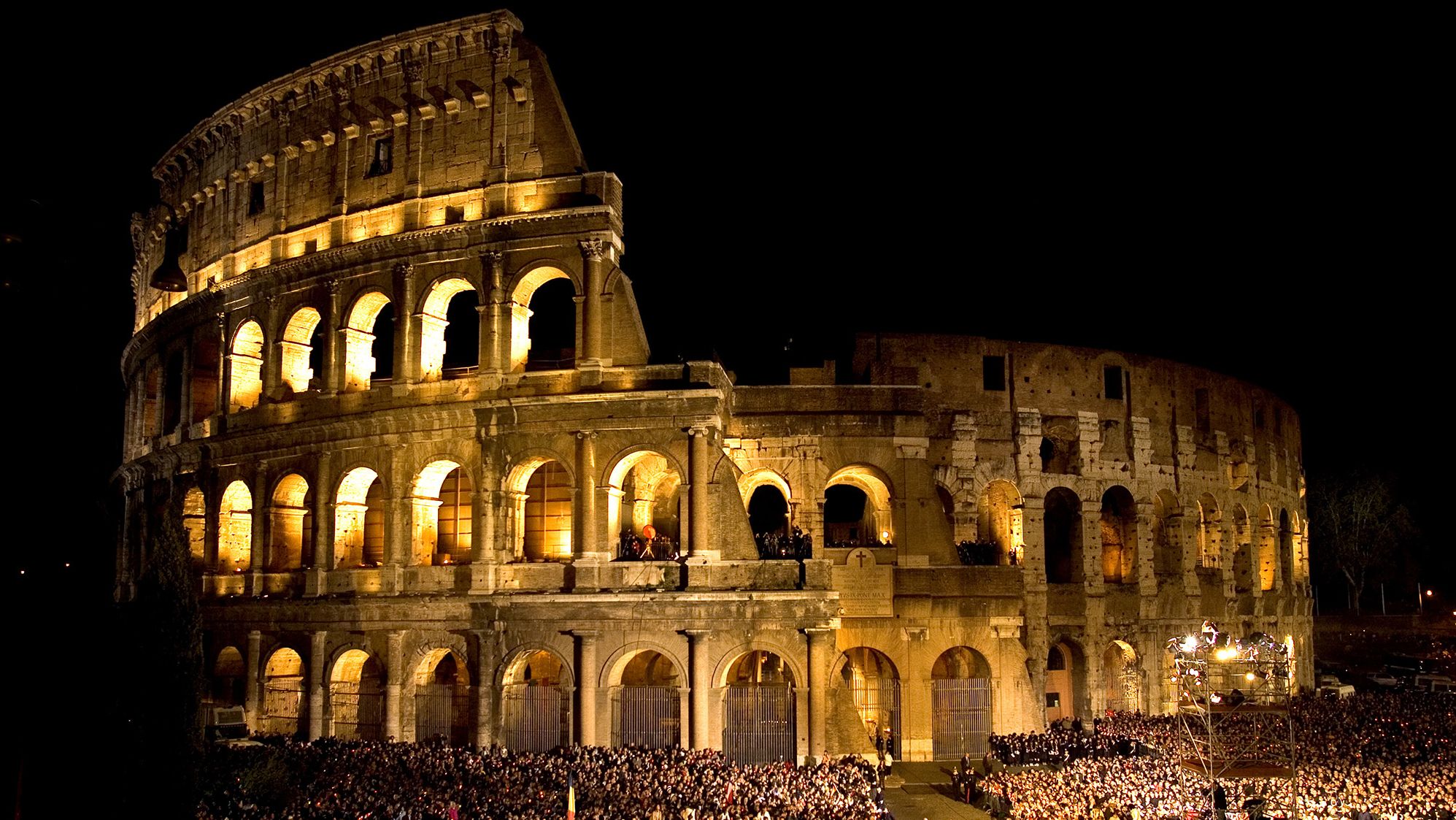 People gather in front of the Roman Colosseum during Benedict's first Way of the Cross devotions in April 2006.