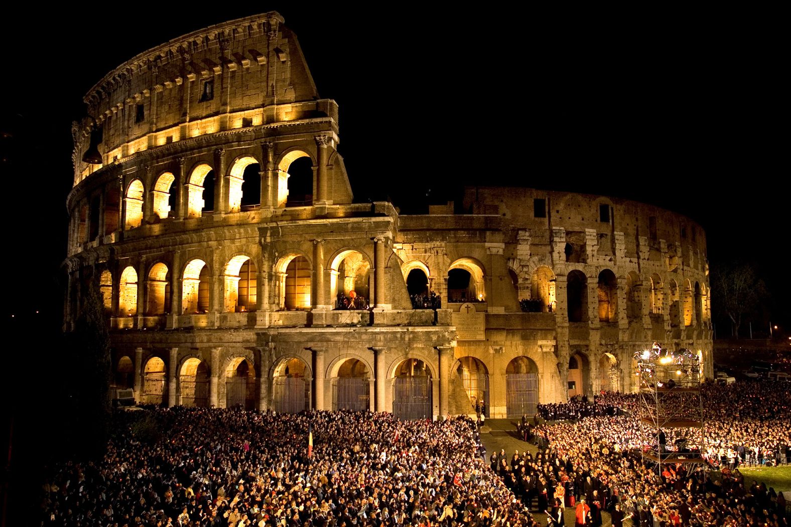 People gather in front of the Roman Colosseum during Benedict's first Way of the Cross devotions in April 2006.