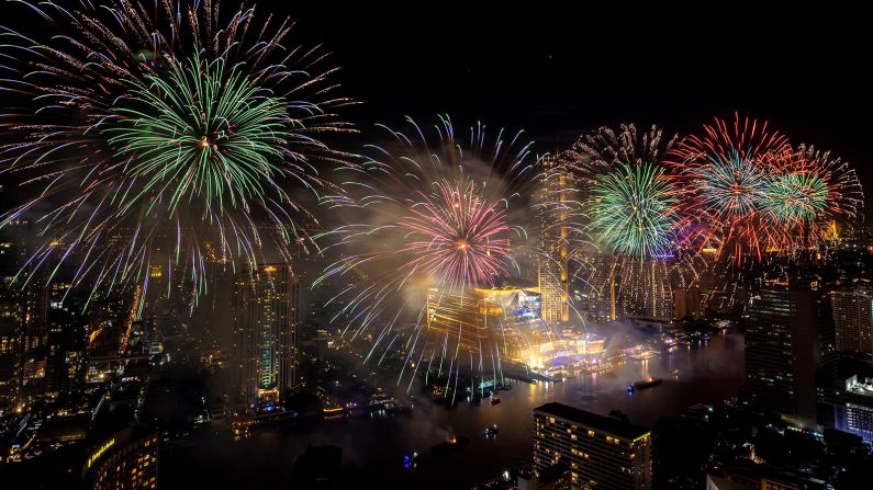 <strong>Bangkok, Thailand:</strong> Fireworks explode over the Chao Phraya River during New Year's Eve celebrations in Bangkok.