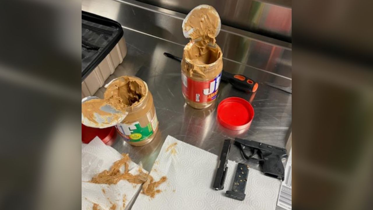 Gun parts and a loaded magazine were discovered concealed in jars of peanut butter. 