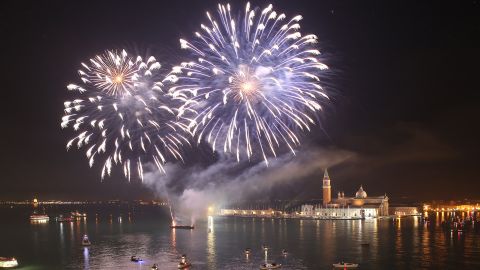 Fireworks explode over the waters and canals of Venice in 2016.