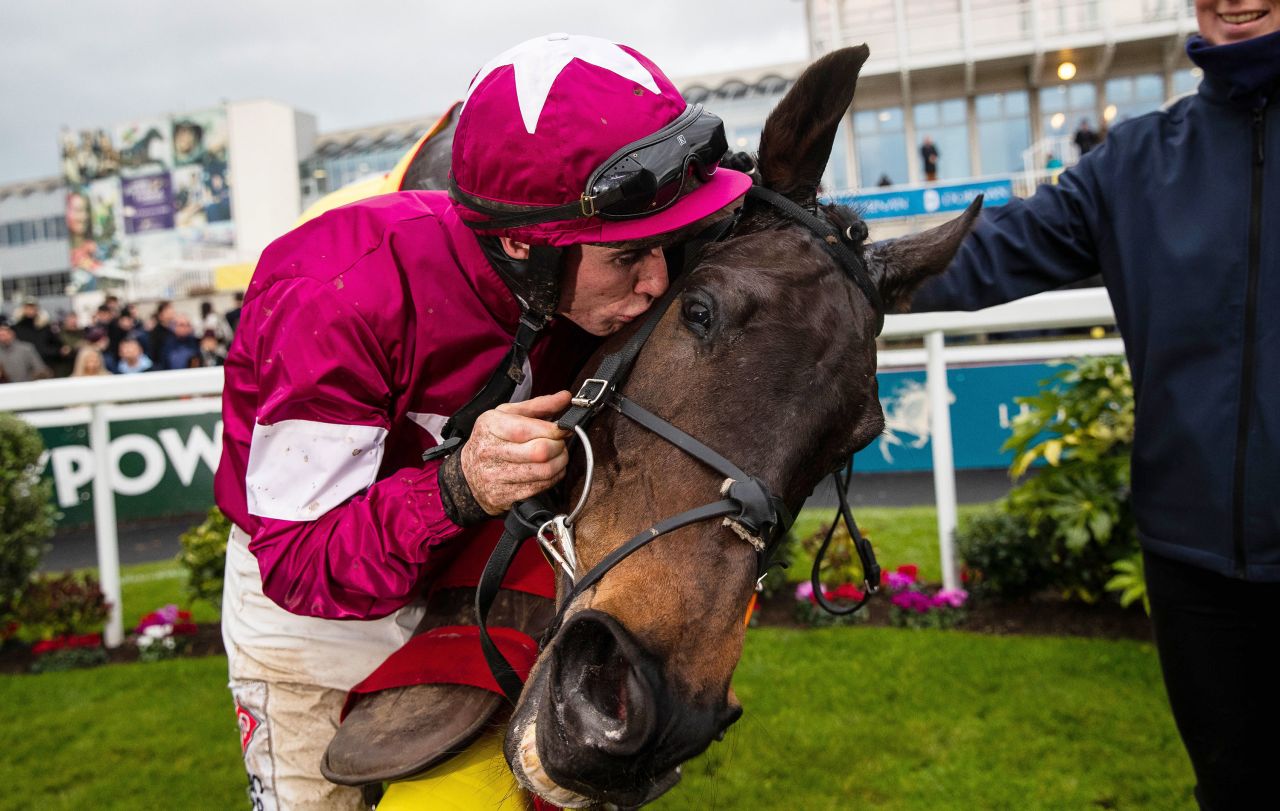 Jockey Jack Kennedy kisses his horse Conflated after winning the Savills Chase in Dublin, Ireland, on Wednesday, December 28.