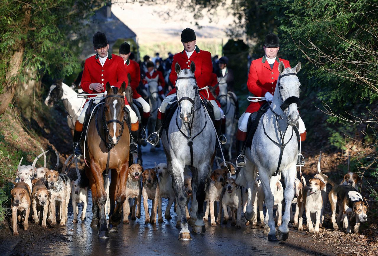 Members of the Old Surrey Burstow and West Kent Hunt ride with hounds during the annual Boxing Day hunt in Chiddingstone, England, on Monday, December 26.