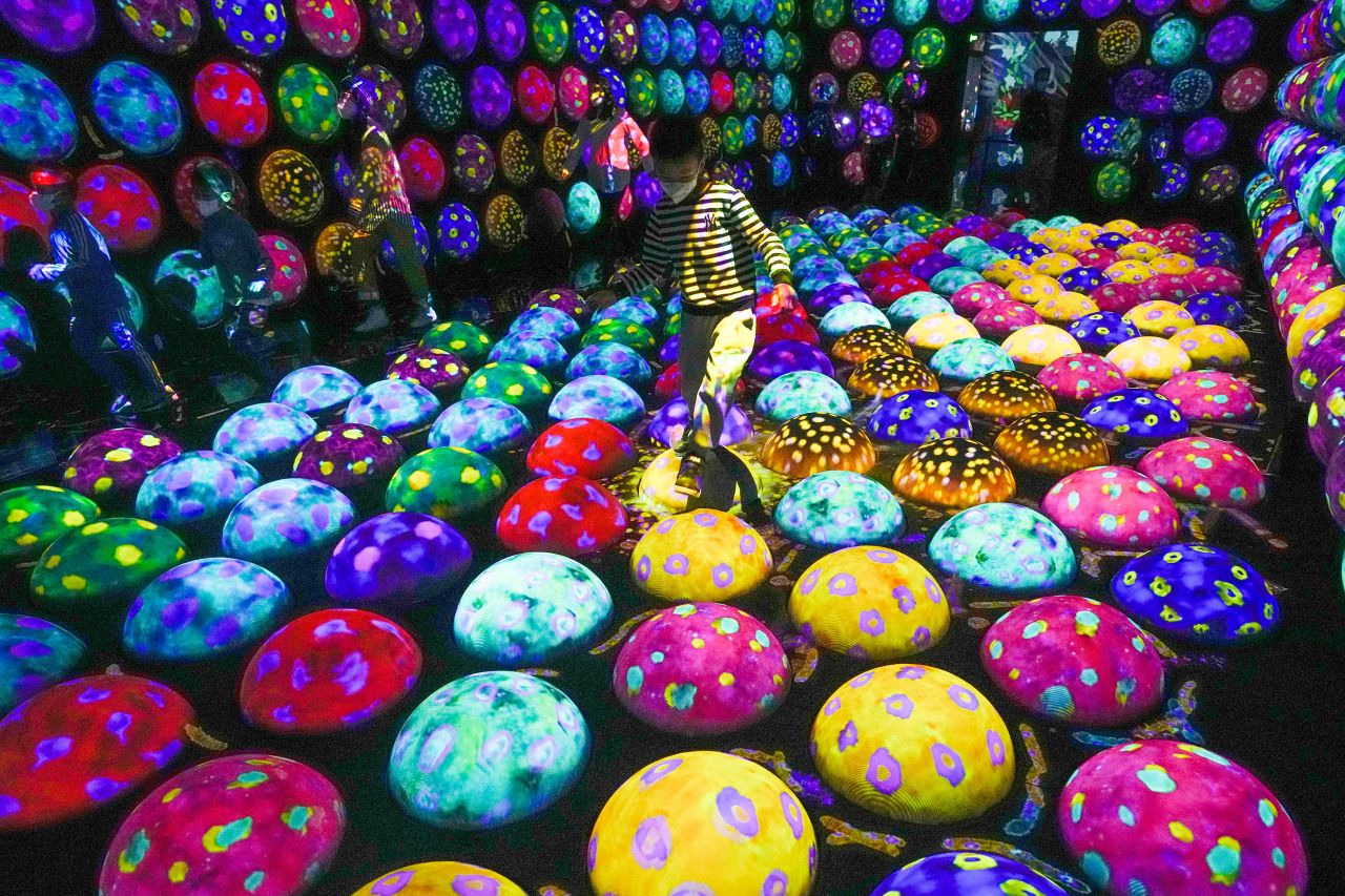 Children play on a digital art installation at the new teamLab Massless museum in Beijing on Monday, December 26. The digital art museum showcases various interactive artworks inside a Beijing shopping mall.