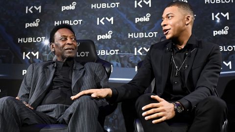 Paris Saint-Germain and France national football team forward Kylian Mbappe (R) and Brazilian football legend Pele take part in a meeting at the Hotel Lutetia in Paris on April 2, 2019.