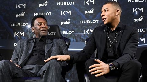 Paris Saint-Germain (PSG) and France soccer team striker Kylian Mbappe (R) and Brazilian soccer legend Pele in Paris on April 2, 2019. 