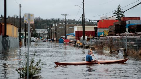 A person kayaks through Seattle's South Park neighborhood on Tuesday, December 27, 2022. 