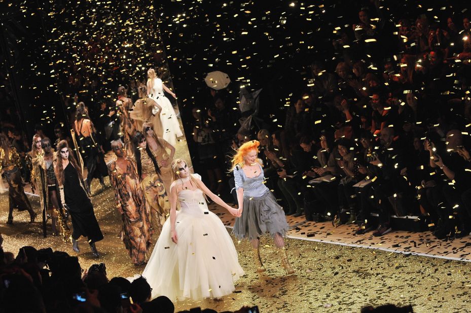 Vivienne Westwood and a model walk the runway of her show during Paris Fashion Week at Pavillon Concorde on March 4, 2011 in Paris, France. 