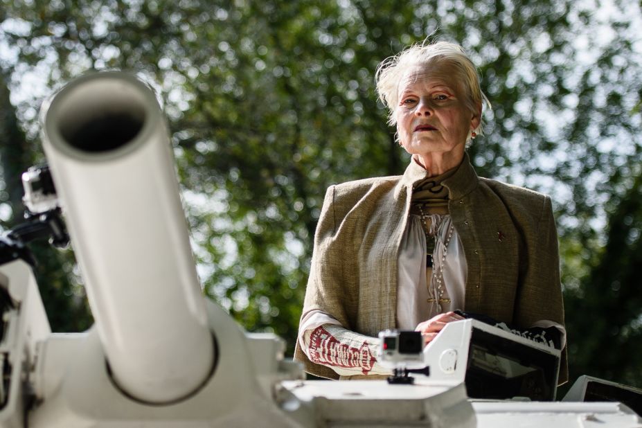 As an environmental campaigner, Vivienne Westwood rides on top of an armored personnel carrier towards British Prime Minister David Cameron's home in Chadlington, Oxfordshire on September 11, 2015 to highlight the government's plan to use fracking to recover fossil fuels from the ground in regions of the north of England. The vehicle parked outside the prime minister's home before a group of protestors in gas masks led chants and held banners calling for the British government to change it's policy on the controversial plans. 