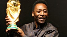 Brazilian football star Pelé displays the FIFA World Cup during its presentation in Rio de Janeiro, Brazil on February 6, 2010. The cup is being exhibited in numerous countries while on a tour before reaching South Africa for the FIFA World Cup tournament that will be held next June. AFP PHOTO/GABRIEL LOPES (Photo credit should read GABRIEL LOPES/AFP via Getty Images)