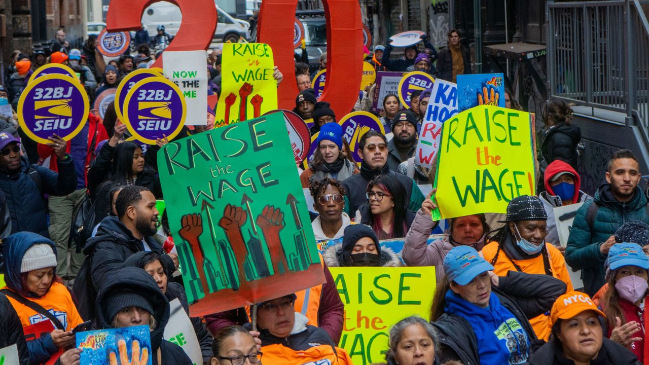 RaiseUpNY Coalition, including the Laborers Internation Union 79 and 32BJ SEIU, hold a rally at City Hall Park to fight for a higher minimum wage in Manhattan, New York, on November 15, 2022. 
