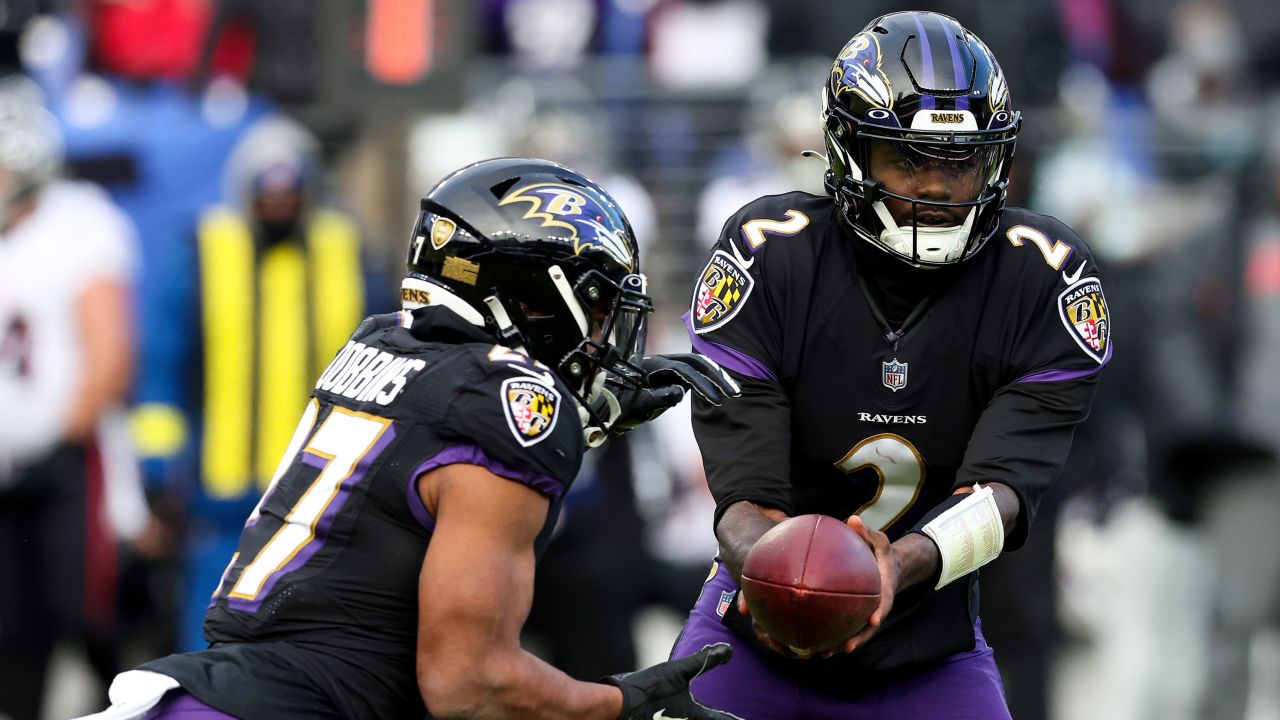 Tyler Huntley hands the ball off against the Atlanta Falcons on December 24.