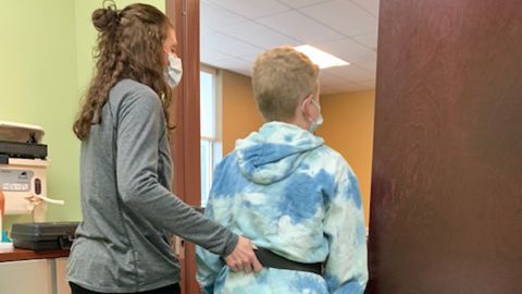 Physical therapist Sara Pesut worked with Ayden on his balance and body position.