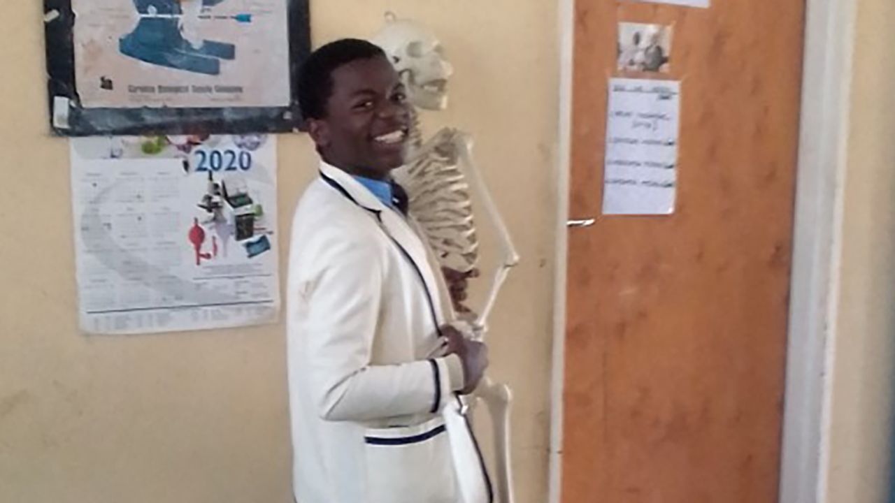 Tatenda in the biology lab, working hard to achieve his medical dreams.