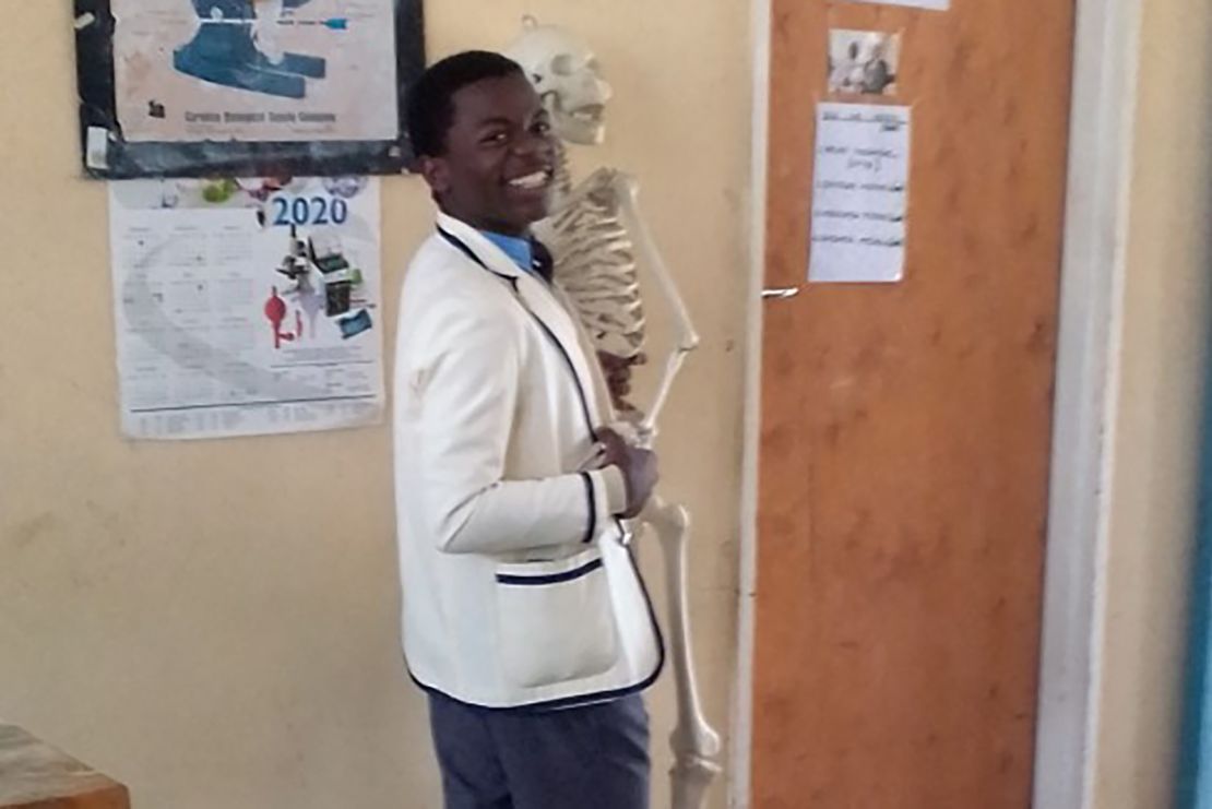 Tatenda in the biology lab, working hard to achieve his medical dreams.