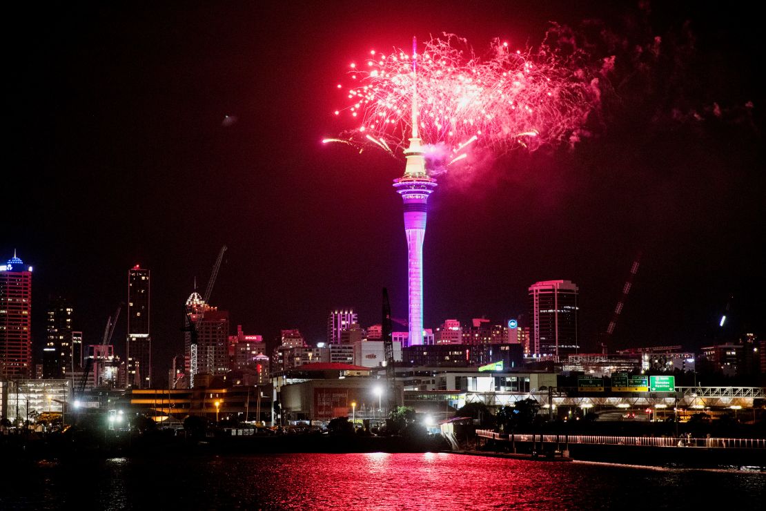 Fireworks explode over Sky Tower in central Auckland as New Year celebrations begin in New Zealand, Sunday, Jan. 1, 2023.