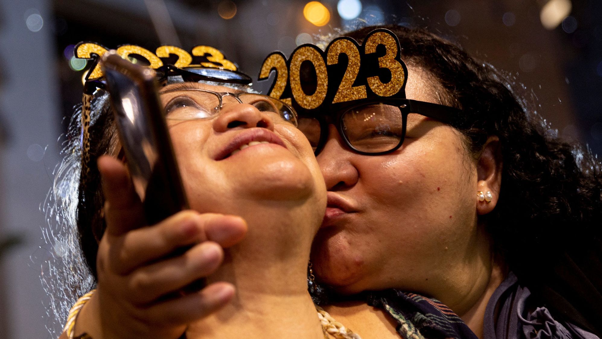 A woman kisses her mother during a New Year's Eve party in Quezon City, Philippines.