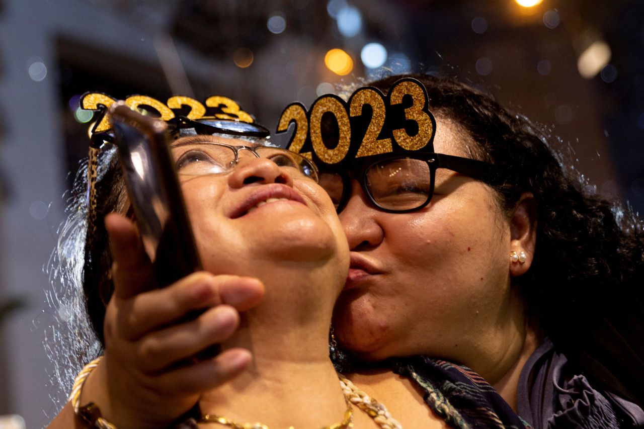 A woman kisses her mother during a New Year's Eve party in Quezon City, Philippines.