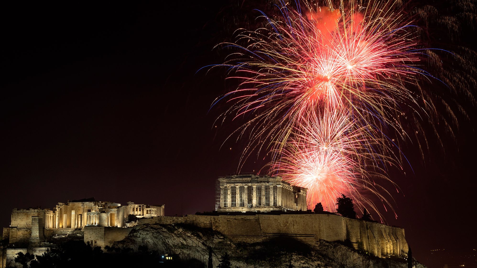 Fireworks explode over the Parthenon in Athens, Greece.
