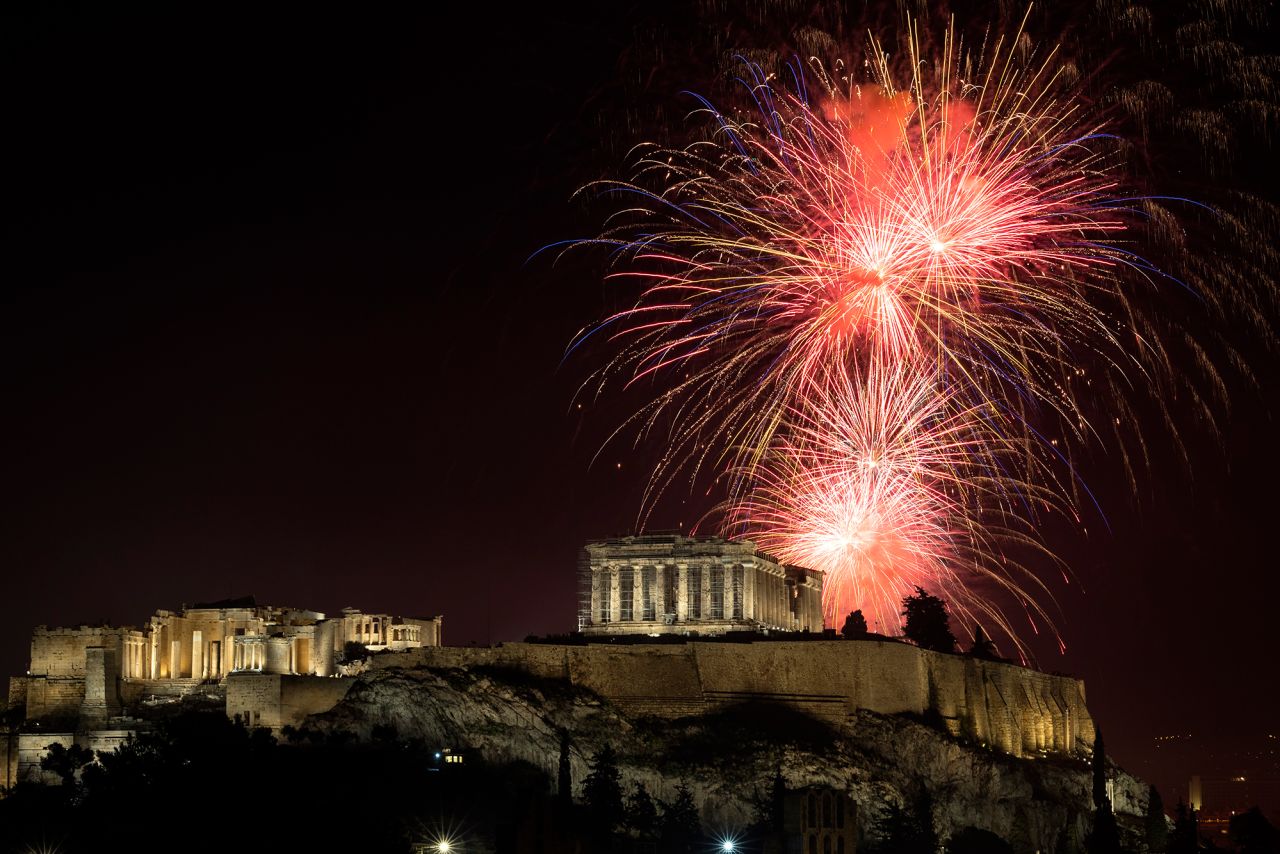 Fireworks explode over the Parthenon in Athens, Greece.