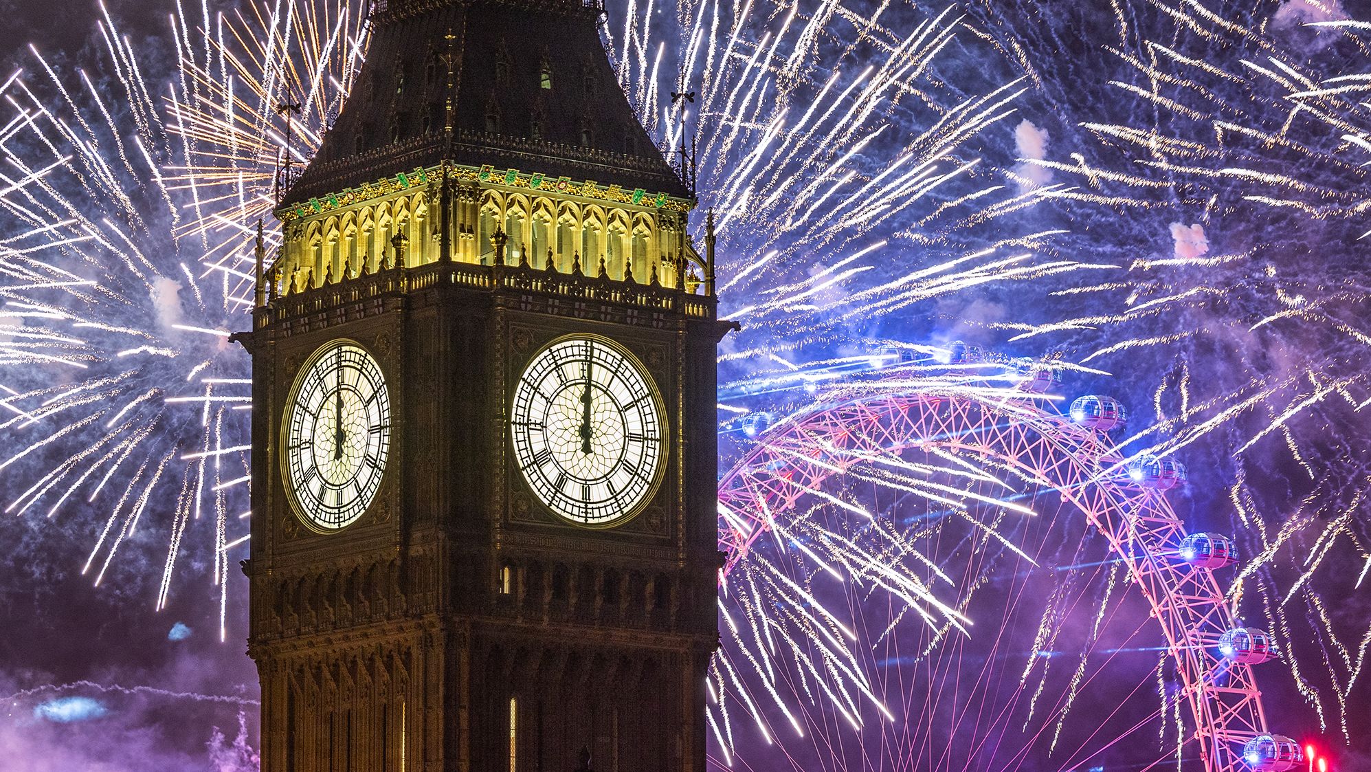Fireworks light up the London skyline over Big Ben and the London Eye.