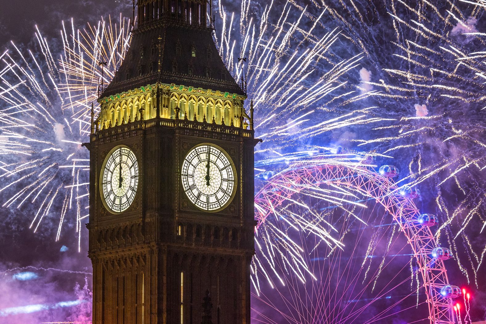 Fireworks light up the London skyline over Big Ben and the London Eye.