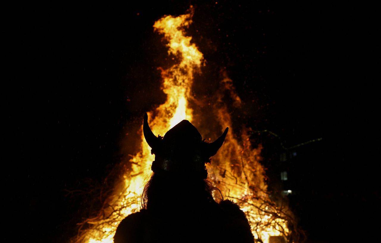 People take part in the annual Allendale Tar Barrel festival in Allendale, England. The New Year's Eve tradition involves costumed men carrying burning whiskey barrels through the town, which are used to ignite a ceremonial bonfire at midnight.
