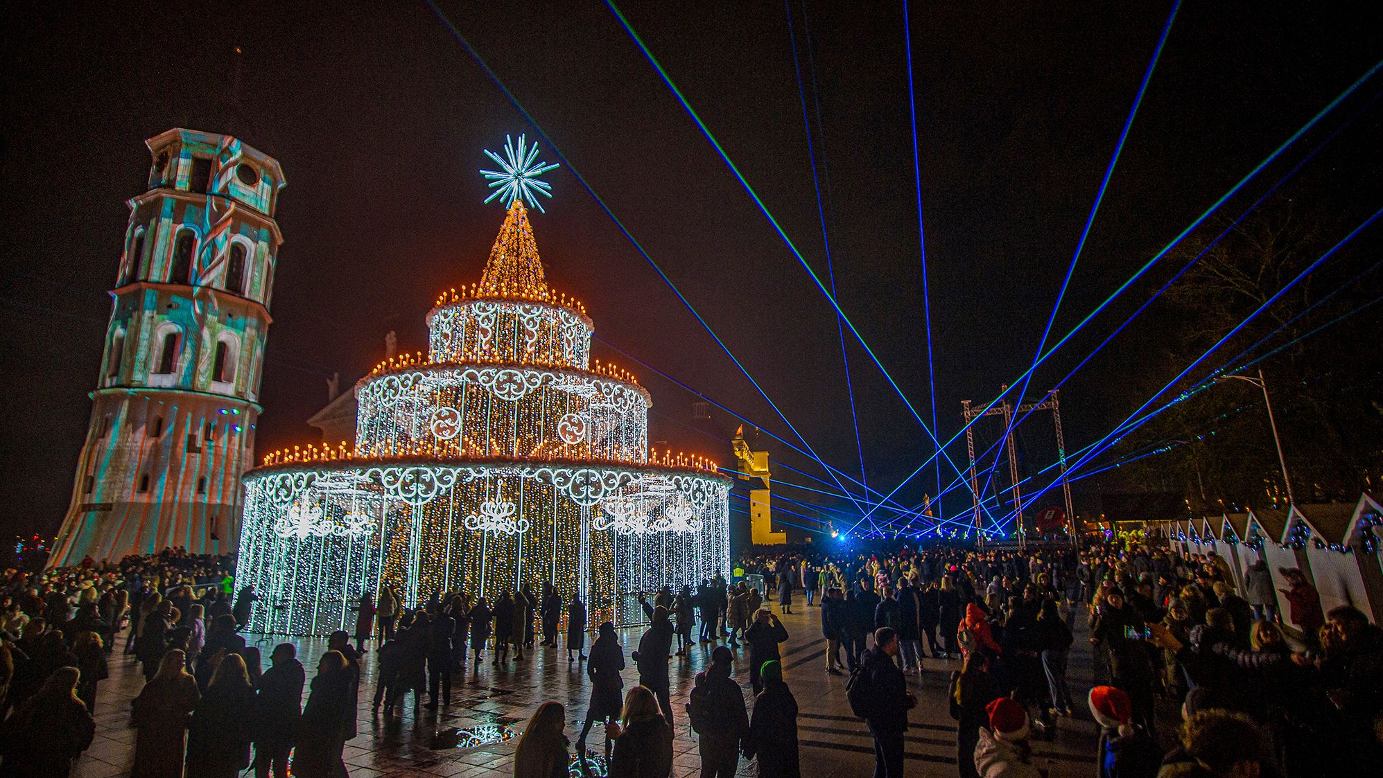 People gather in Vilnius, Lithuania, to watch a light and laser show.