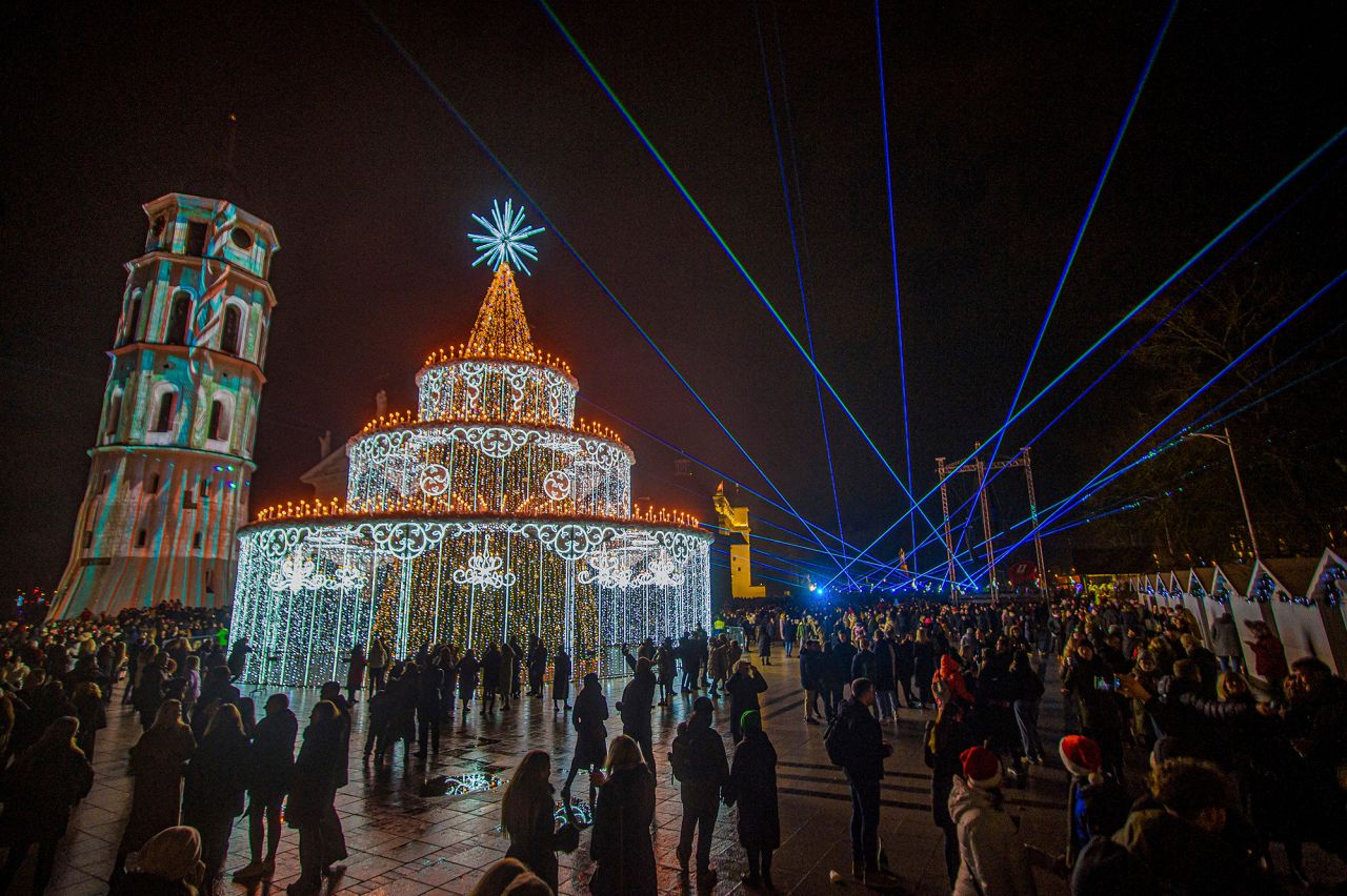 People gather in Vilnius, Lithuania, to watch a light and laser show.
