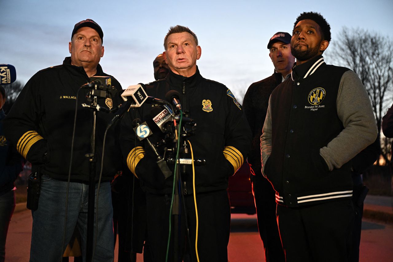 Baltimore Police Commissioner Richard Worley, with Mayor Brandon Scott, right, and Fire Department Chief James Wallace, left, speaks at a press conference on the collapse of the Francis Scott Key Bridge Baltimore, Maryland, on March 26.