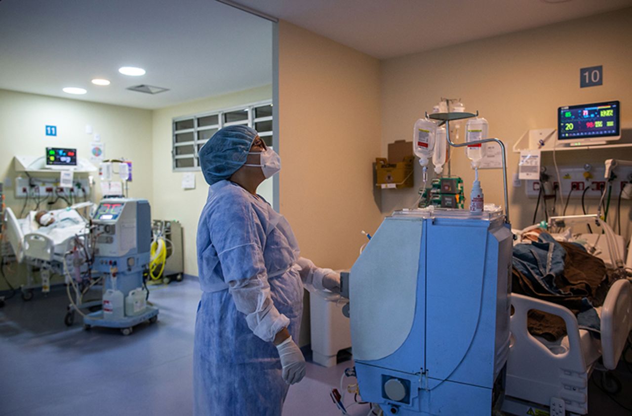 A health worker cares for a COVID-19 patient at an Intensive Care Unit of the Ronaldo Gazolla Public Municipal Hospital in Rio de Janeiro, Brazil, on March 5, a year after the first coronavirus case was registered in the city. 