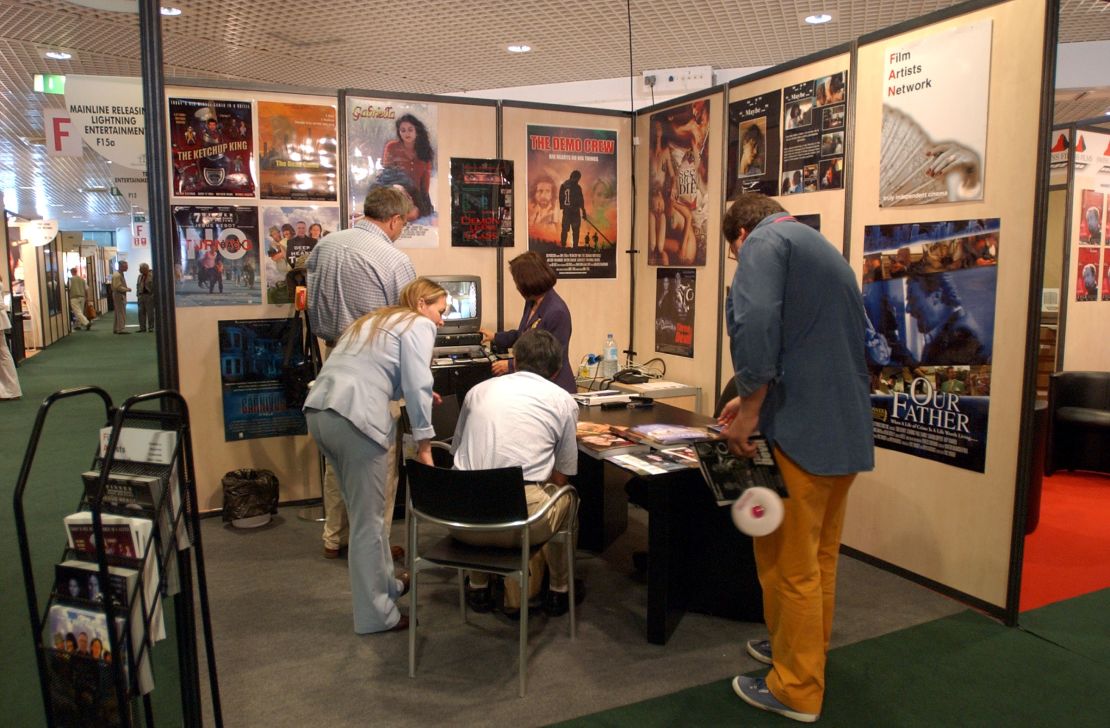 People visit the Marche du Film at Cannes 2014.