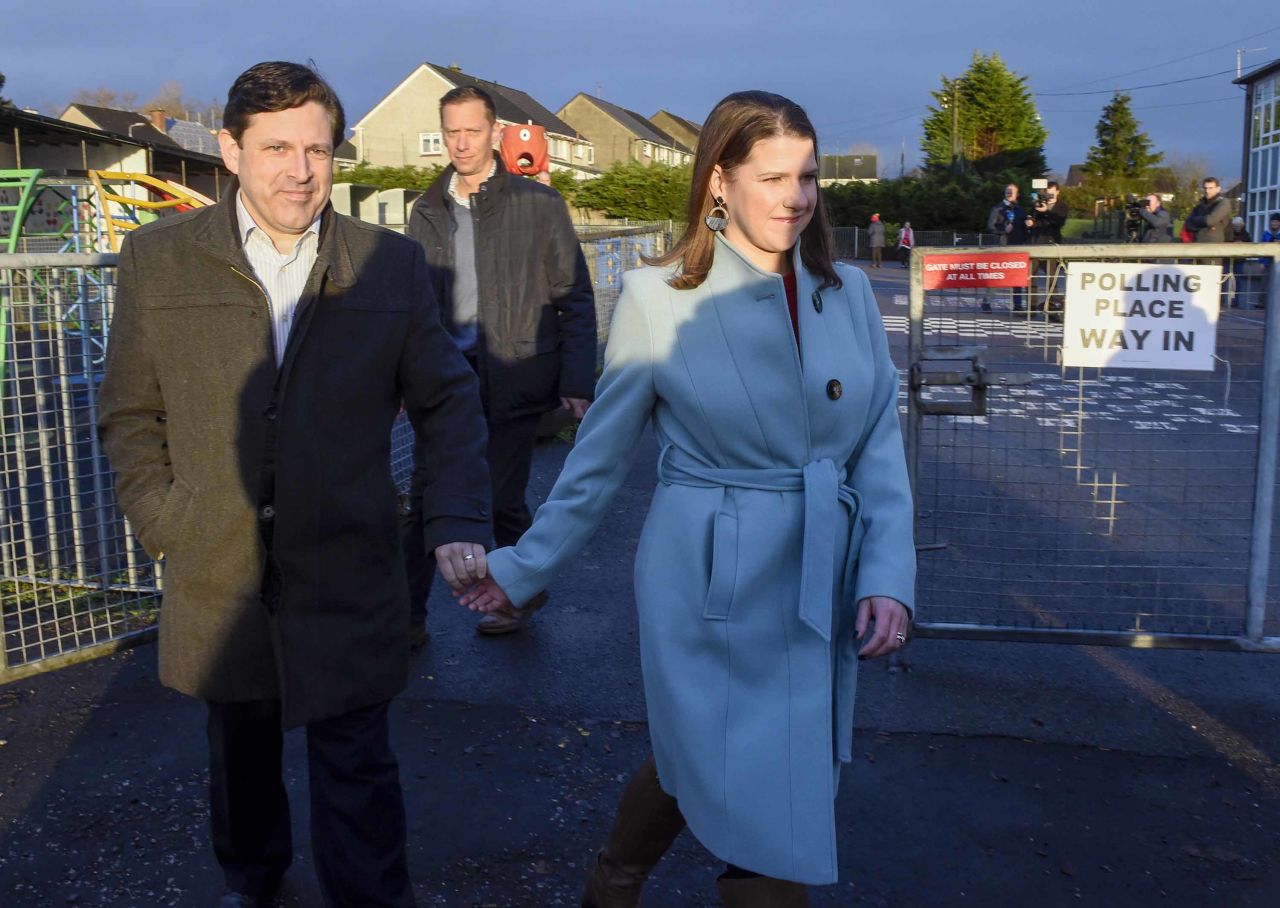 Liberal Democrat leader Jo Swinson and her partner Duncan Hames leave the Castlehill Primary School in Glasgow, Scotland, after casting their votes. Photo: Ian Rutherford/PA Images via Getty Images