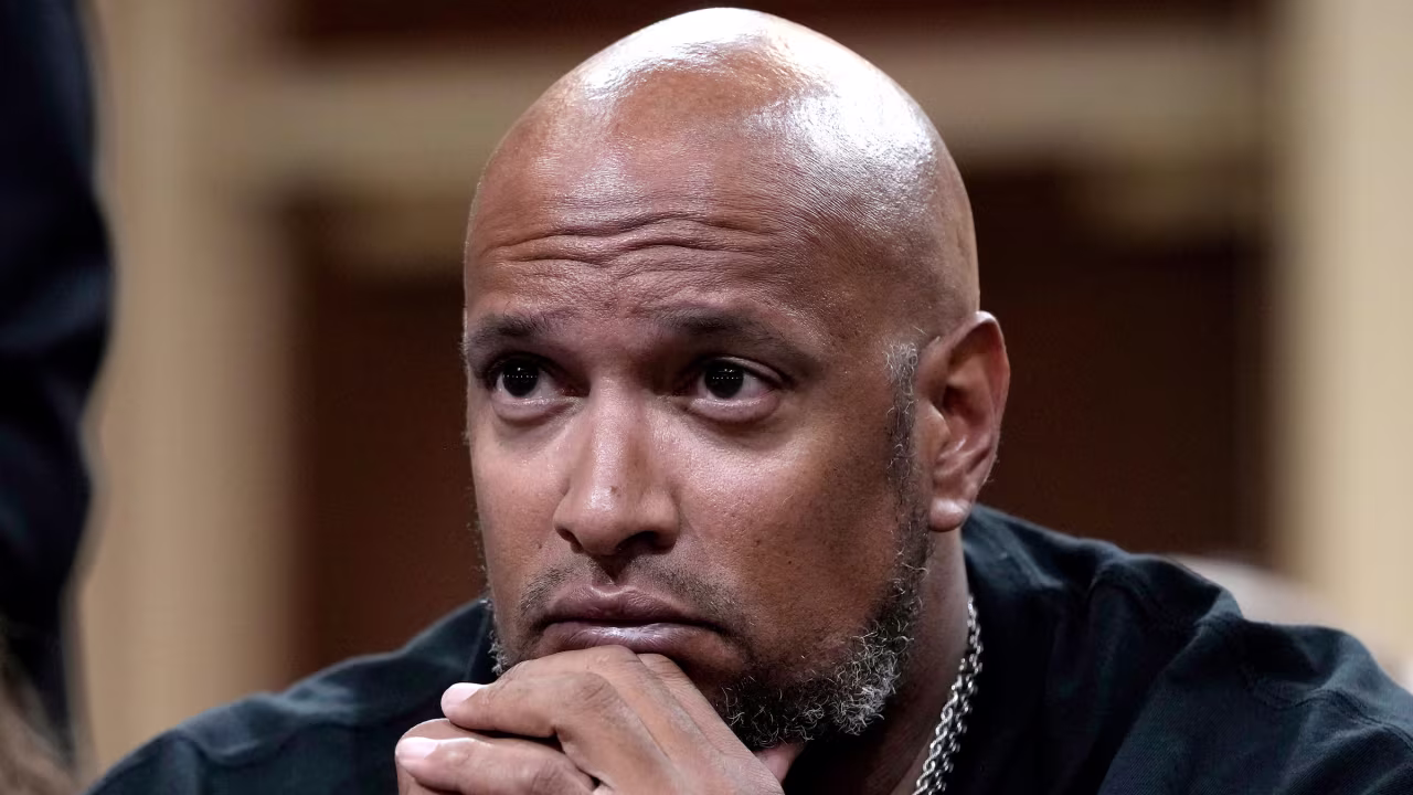 Harry Dunn, one of the police officers who defended the Capitol on January 6, listens to testimony while attending Thursday's hearing.