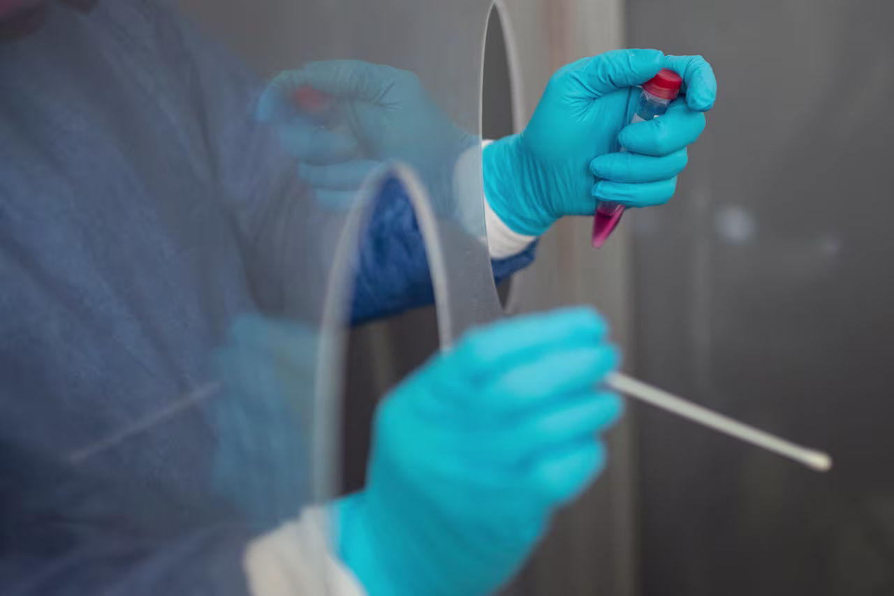 A health worker prepares to collect a swab sample to test a patient for Covid-19 in Nezahualcoyotl, Mexico state on July 13, amid the coronavirus pandemic. 