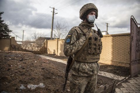 A Ukrainian soldier patrols in the village of Novoluhanske, located in the Luhansk region, in Ukraine, on February 19.