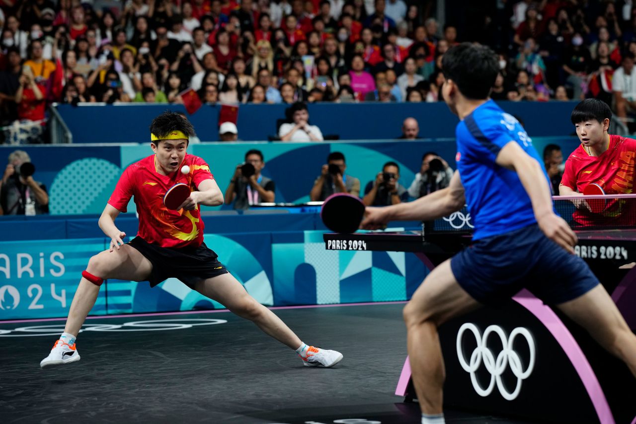 China's Wang Chuqin, left, and Sun Yingsha play against North Korea's Kim Kum Yong and Ri Jong Sik during the mixed doubles table tennis final on Tuesday.