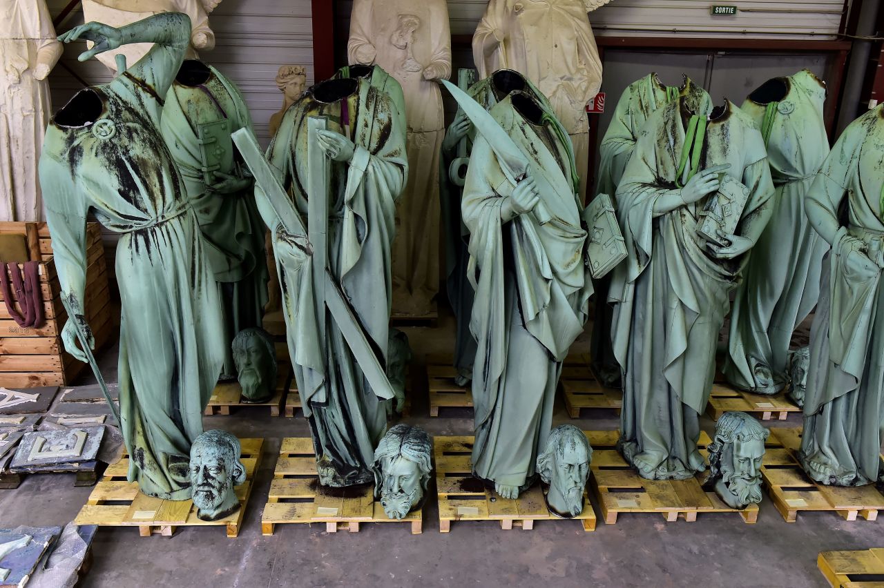 Statues which sat around the spire of the Notre-Dame cathedral stored in a workshop before restoration at Marsac-sur-Isle, near Bordeaux, on Tuesday.