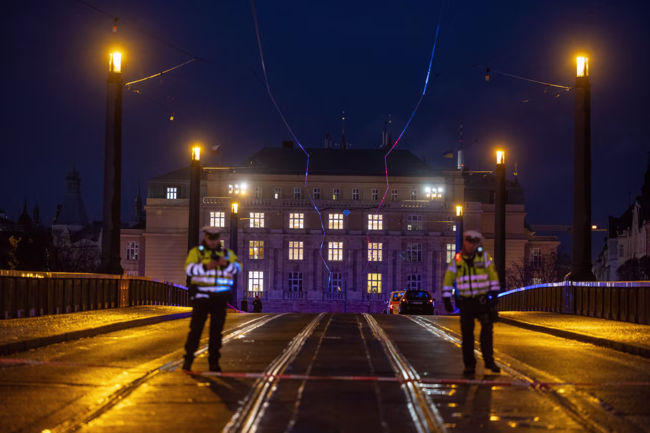Police are seen standing near Charles University in Prague on Thursday.
