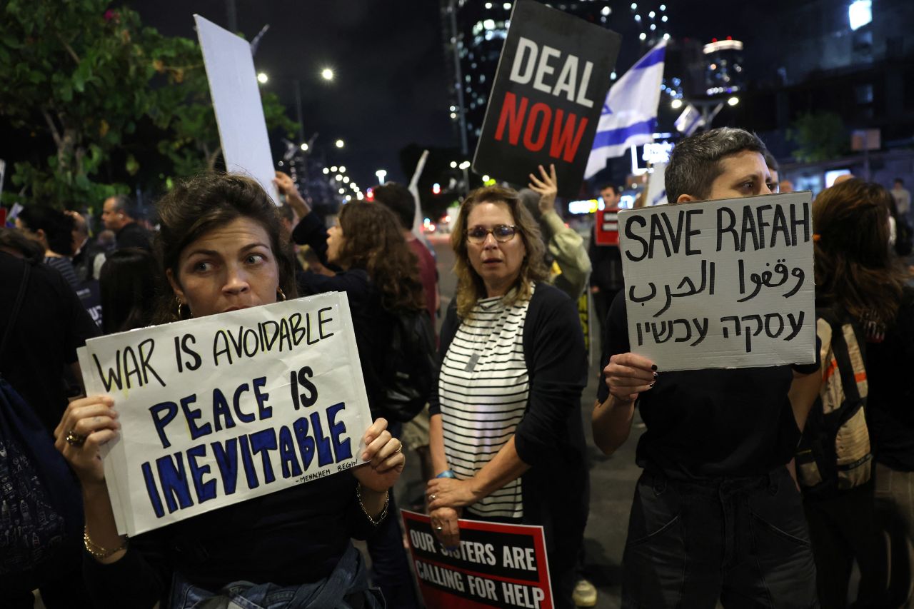 Relatives and supporters of hostages taken captive by Hamas militants during the October 7 attacks, hold placards during a demonstration calling for their release, in Tel Aviv, on May 6. 