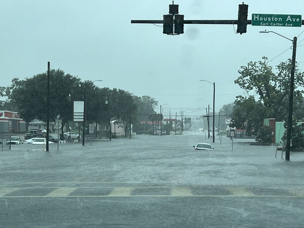 A car is seen submerged in floodwaters in Live Oak, Florida, on Monday.