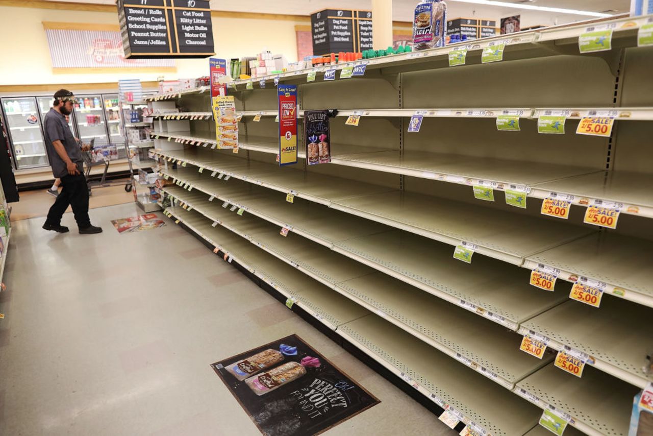 A store's bread shelves are bare as people stock up on food ahead of the arrival of Hurricane Florence on Sept. 11, 2018 in Myrtle Beach, South Carolina.