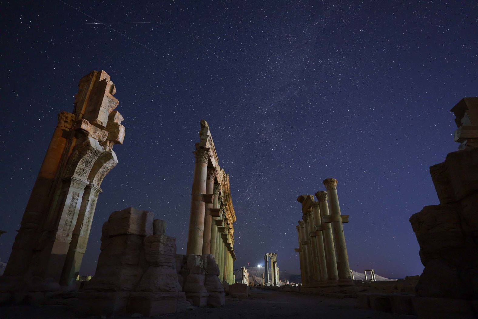 Stars are seen above the ancient ruins of Palmyra in central Syria on Sunday, August 24.