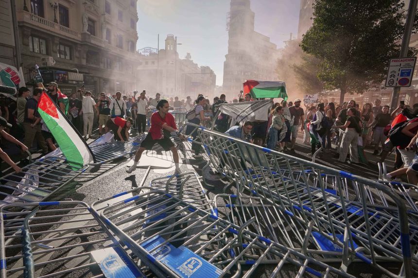Protesters block the road in an attempt to disrupt the 21st stage of the Spanish cycling race La Vuelta, from Alalpardo to Madrid, Spain, on September 14, 2025.
