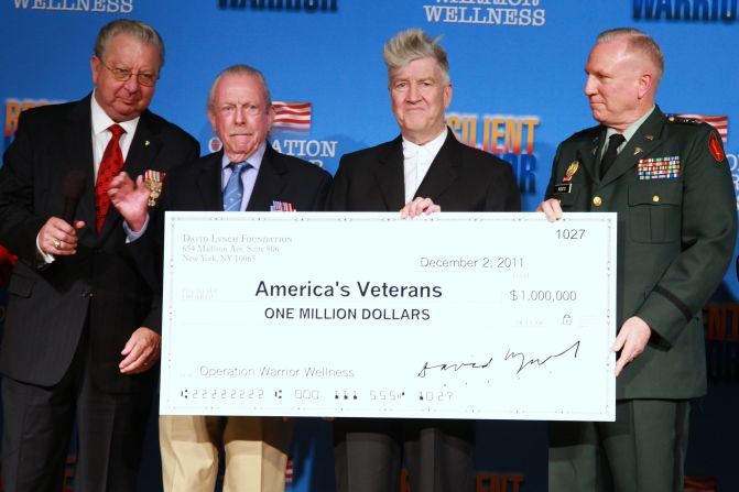 Lynch holds a check for Operation Warrior Wellness in 1994. Operation Warrior Wellness is a division of the David Lynch Foundation that teaches meditation as a tool to help veterans with post-traumatic stress disorder.