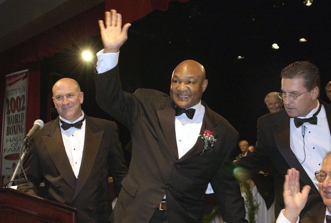 Foreman waves as he is greeted at the World Boxing Hall Of Fame's Banquet of Champions in 2002.