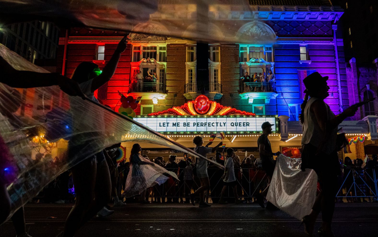 The Austin Pride Parade proceeds down Congress Avenue, past The Paramount Theatre in Austin, Texas, on Saturday, August 10.