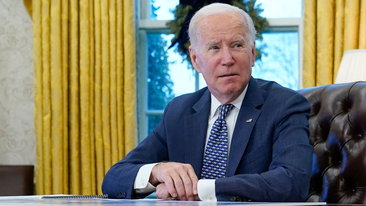 President Joe Biden participates in a briefing in the Oval Office of the White House, December 22, 2022, in Washington. 