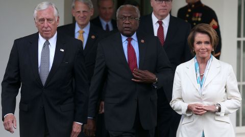 House Democratic leaders, front row from left, Steny Hoyer, Jim Clyburn and Nancy Pelosi walk out of the West Wing of the White House in Washington, DC, on October 15, 2013.